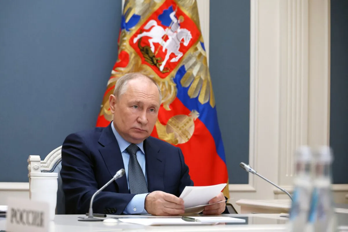 Russian President Vladimir Putin attends the G20 virtual summit via a video link in Moscow on Nov. 22, 2023. (Sputnik/Mikhail Klimentyev/Kremlin via Reuters)