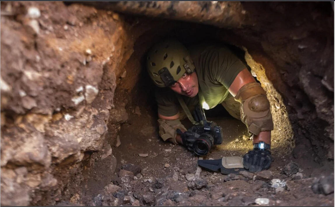 A border patrol agent inspects a man-made tunnel used to smuggle drugs under the U.S. border, in this file photo. (Josh Denmark/U.S. Customs and Border Protection)