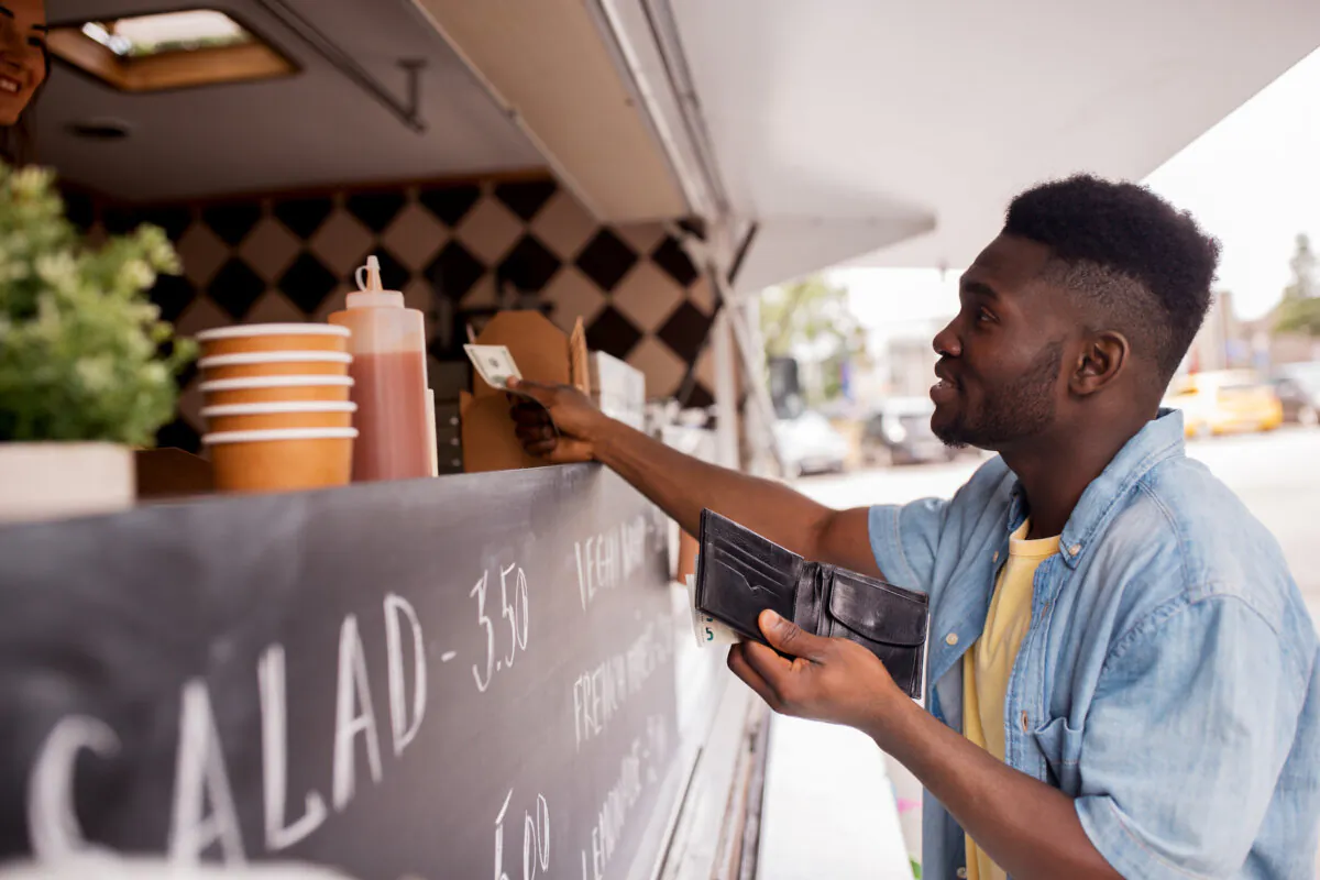 Leave the plastic at home and start paying with cash. (Ground Picture/Shutterstock)