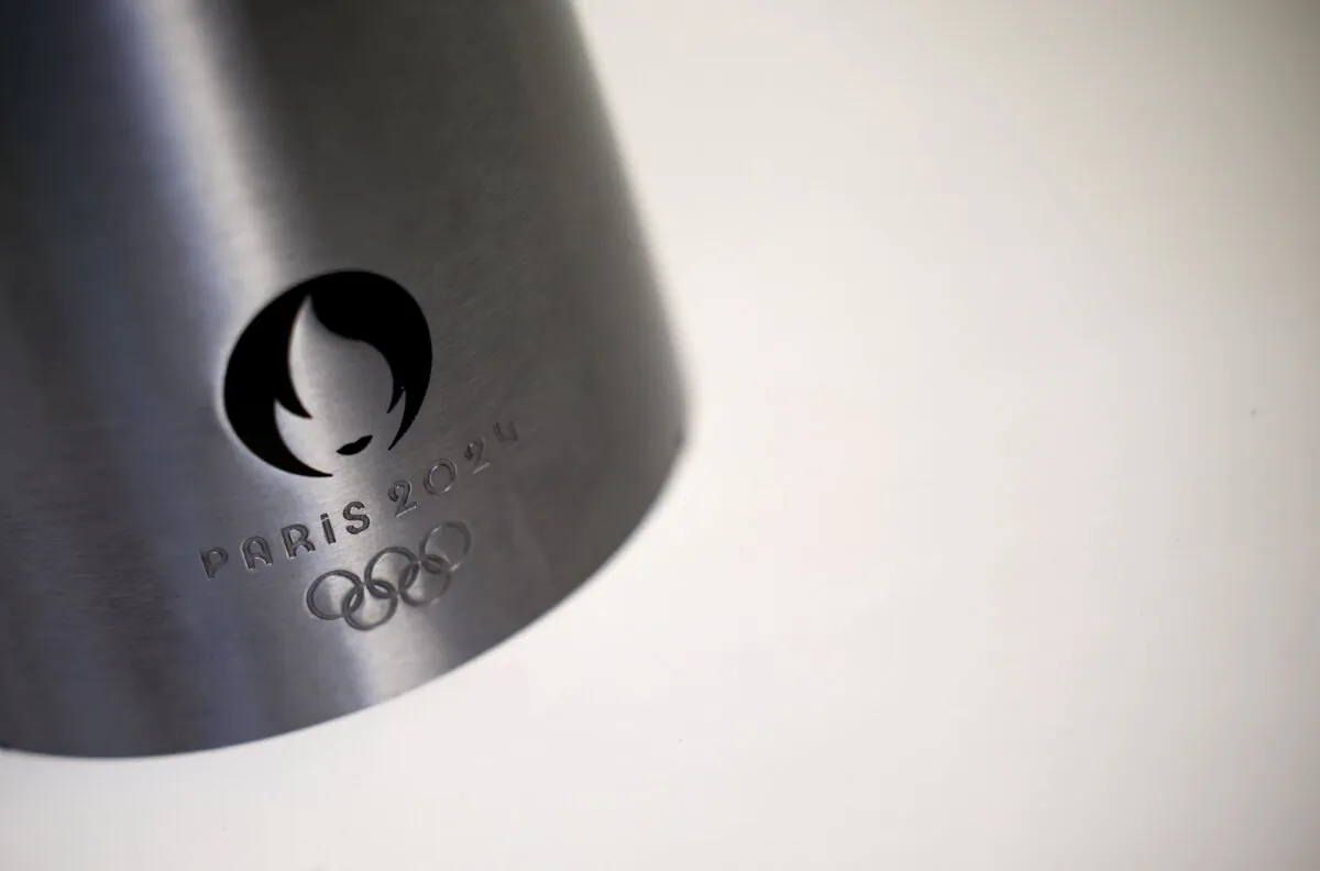 The logo of the Paris 2024 Olympic and Paralympic Games on an Olympic torch during a press visit at the Guy Degrenne factory in Vire, France, on  Nov. 17, 2023. (Stephane Mahe/Reuters)