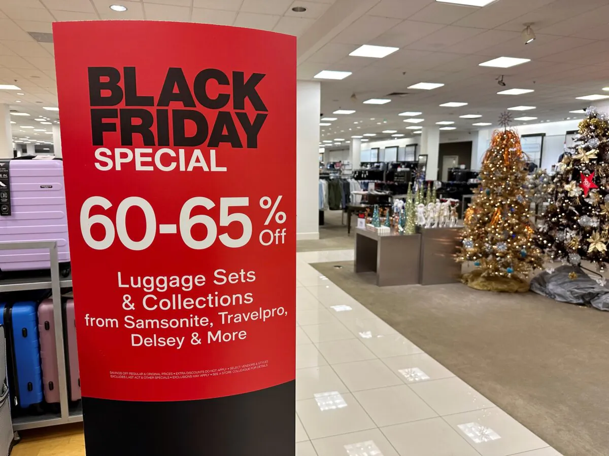 A sign announces Black Friday specials on luggage sets inside a Macy's department store in Denver on Nov. 20, 2023. (David Zalubowski/AP Photo)