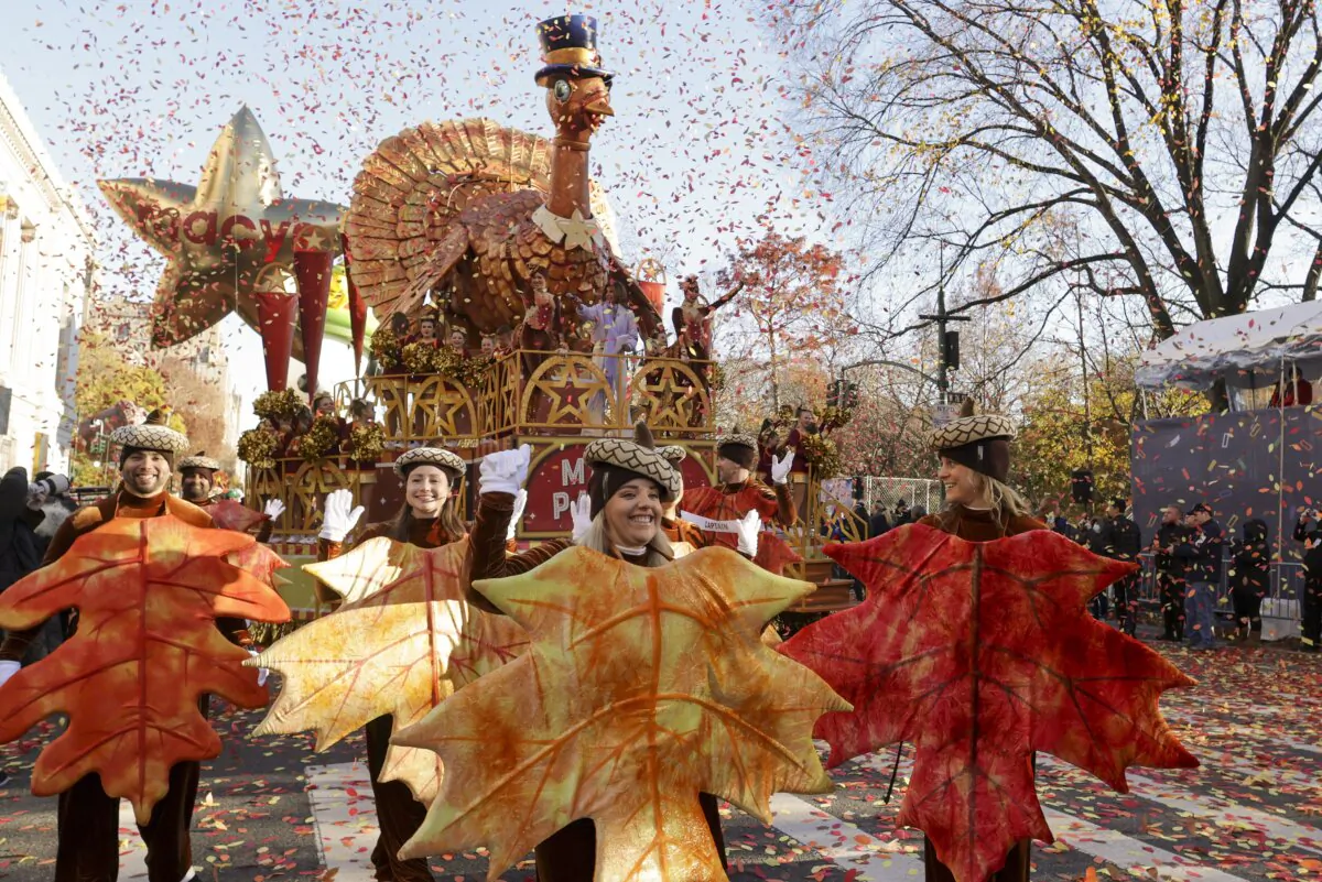Parade performers lead the Tom Turkey float down Central Park West at the start of the Macy's Thanksgiving Day parade in New York on Nov. 23, 2023. (Jeenah Moon/AP Photo)