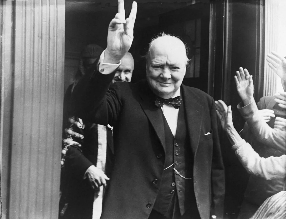British Prime Minister Winston Churchill gives his well-known wartime V-sign at Dover in 1951. Churchill famously crossed the floor twice. (Central Press/Hulton Archive/Getty Images)