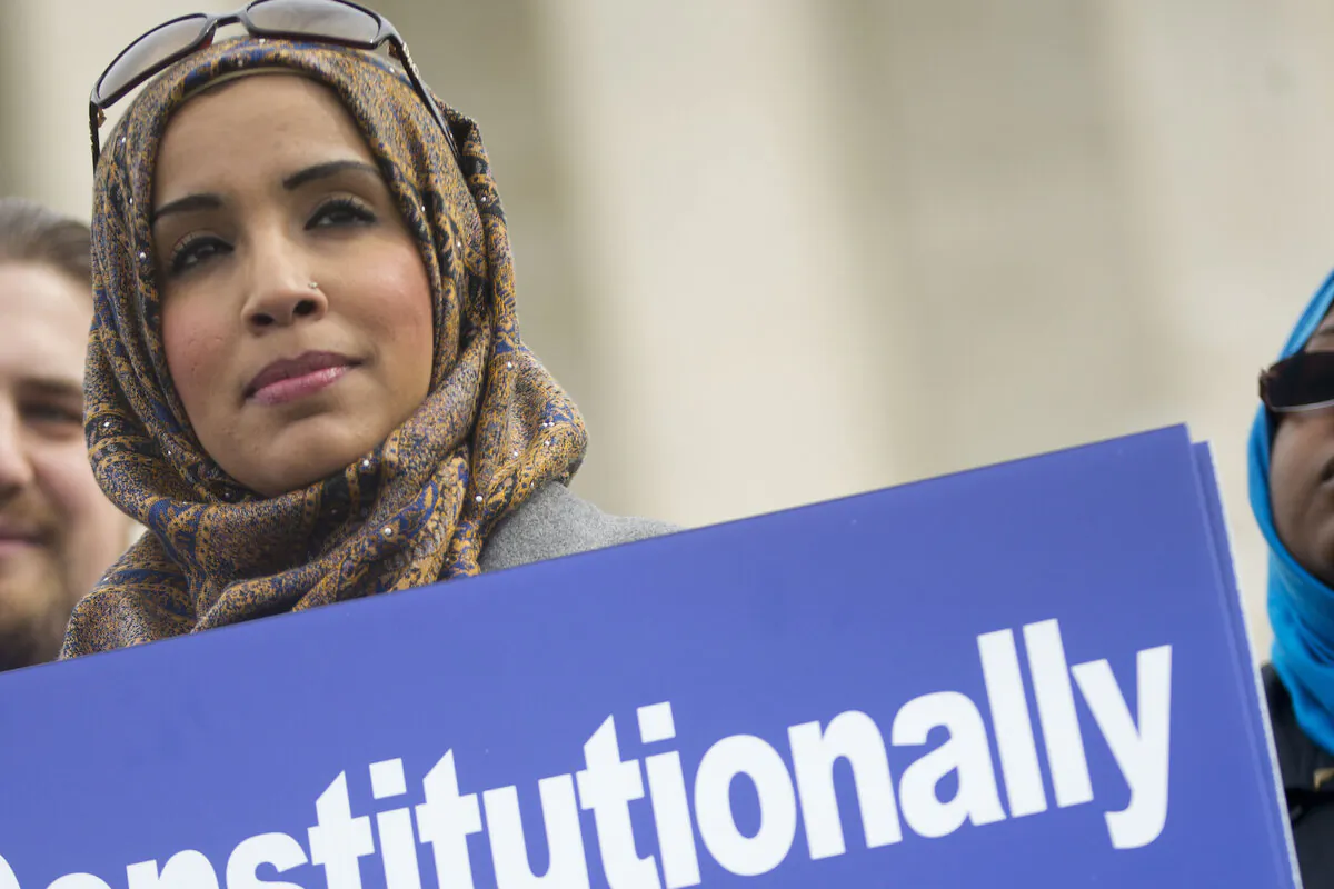 Zainab Chaudry joins other demonstrators outside the U.S. Supreme Court in Washington on Feb. 25, 2015. (Pablo Martinez Monsivais/AP Photo)