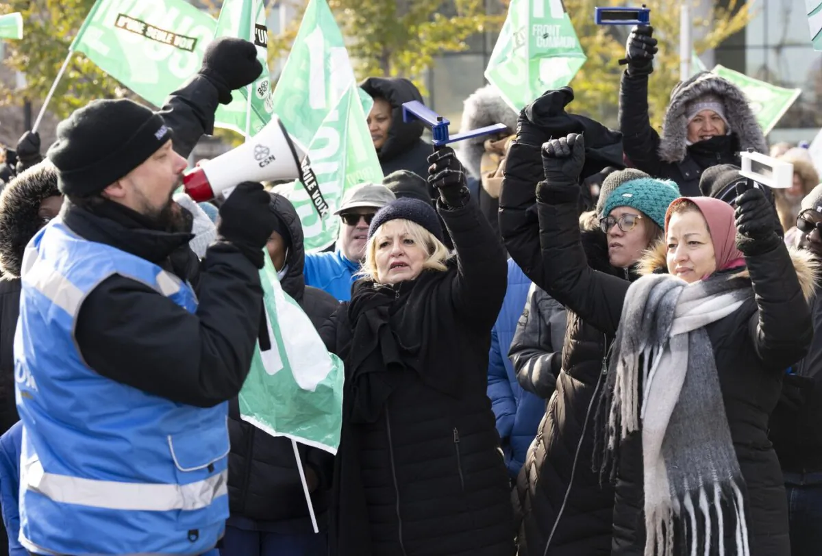 Quebec health and social service workers strike outside the CHUM hospital in Montreal, on Nov. 21, 2023. (The Canadian Press/Christinne Muschi)