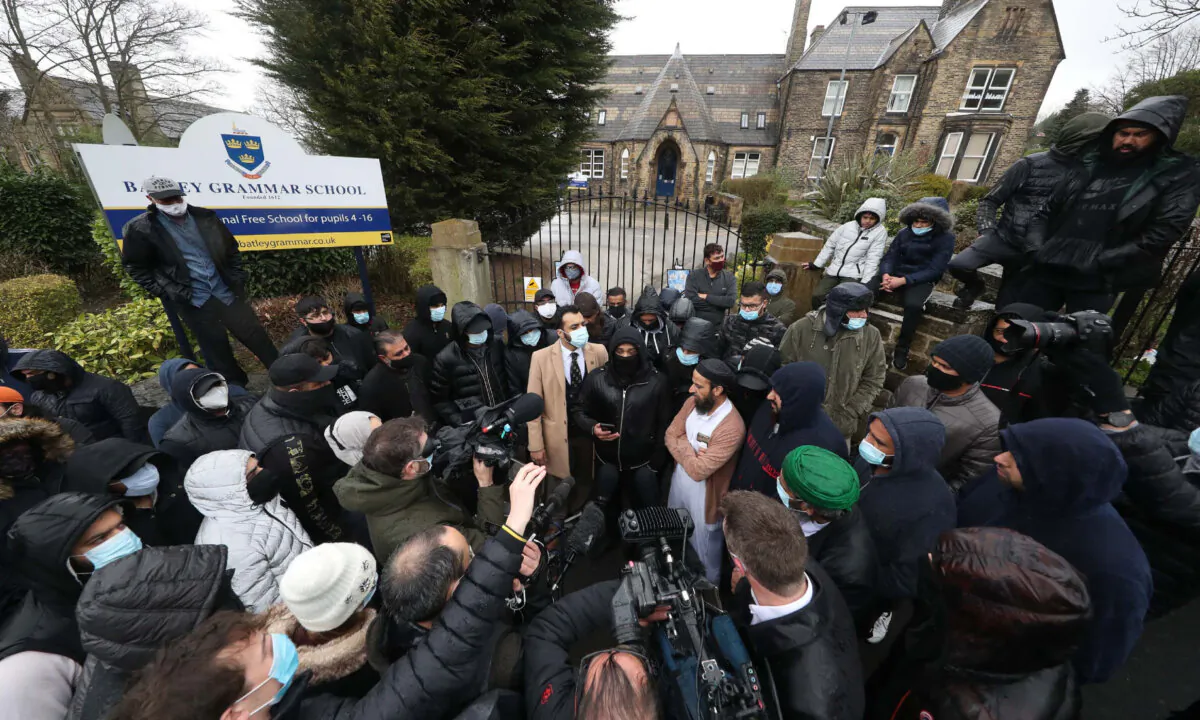 Muslim protesters at Batley Grammar School West Yorkshire on March 26, 2021. (PA Media/Danny Lawson)