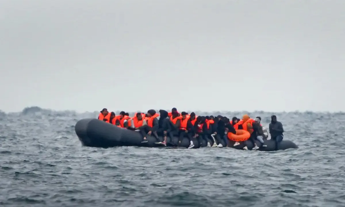 A group of people thought to be migrants crossing the Channel in a small boat traveling from the coast of France and heading in the direction of Dover, Kent on Aug. 29, 2023. (PA Media)
