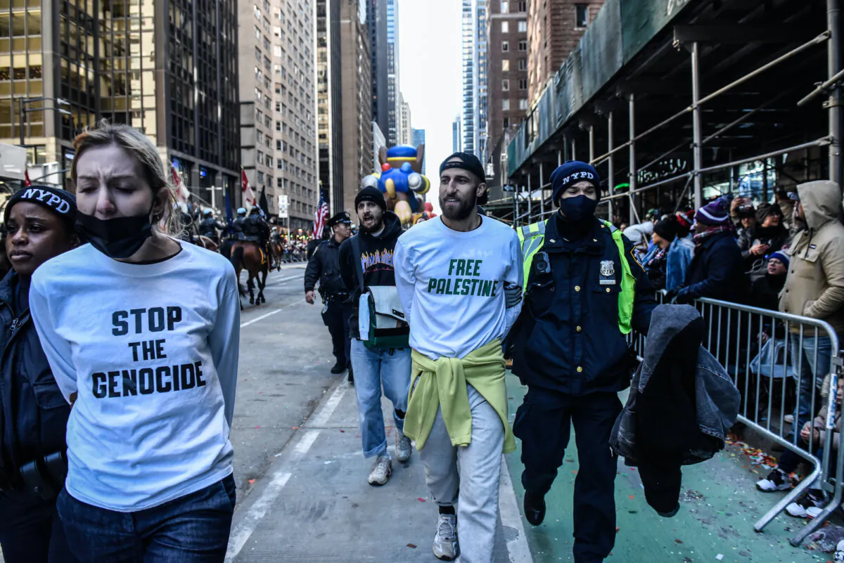 Pro-Palestinian protesters are detained during Macy's annual Thanksgiving Day Parade in New York City, on Nov. 23, 2023. (Stephanie Keith/Getty Images)