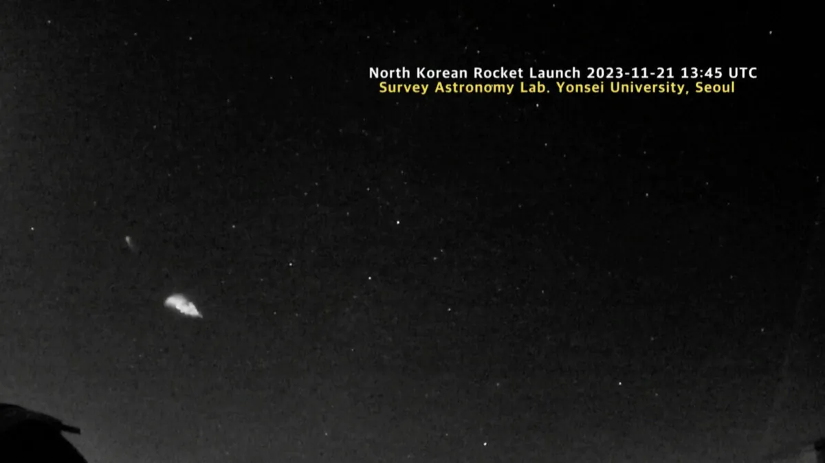 A still from astronomy camera footage shows the first stage of rocket that is believed to be carrying North Korea's spy satellite crossing sky on Nov. 21, 2023. (Byun Yong-Ik/Yonsei University via Reuters/Screenshot via The Epoch Times)