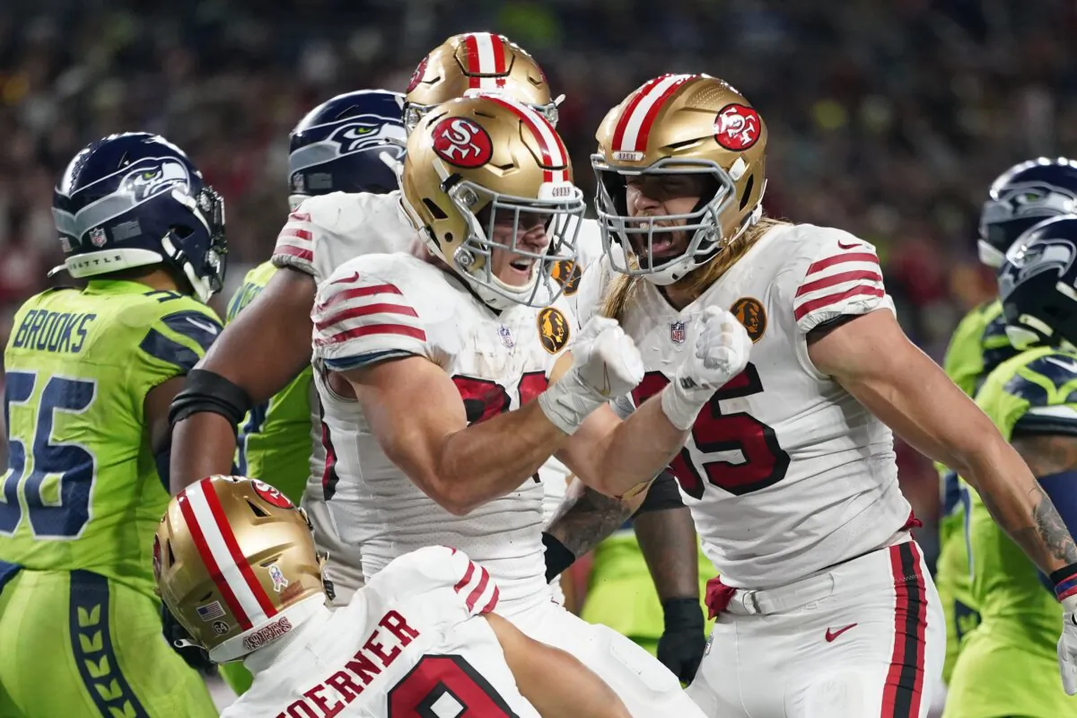 San Francisco 49ers running back Christian McCaffrey (23) reacts after scoring a touchdown during the first half of an NFL football game against the Seattle Seahawks in Seattle on Nov. 23, 2023. (Lindsey Wasson/AP Photo)
