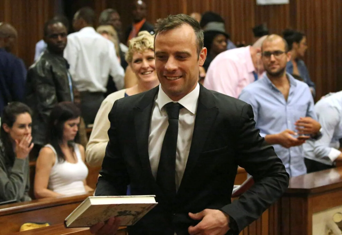 Oscar Pistorius, (C), leaves a courtroom of the High Court in Pretoria, South Africa, on Dec. 8, 2015. (Siphiwe Sibeko/Pool/AP Photo)