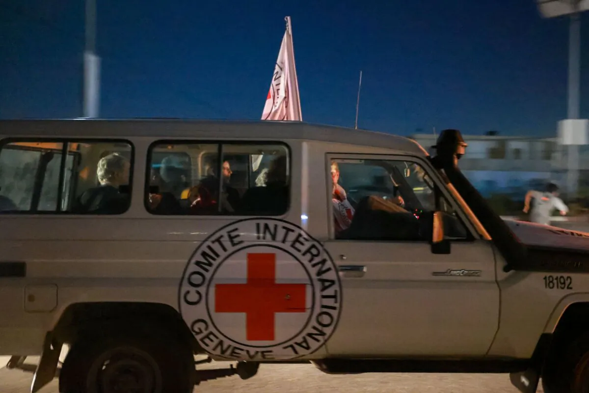 An International Red Cross vehicle reportedly carrying hostages released by Hamas crosses the Rafah border point in the Gaza Strip towards Egypt from where they would be flown to Israel to be reunited with their families, on Nov. 24, 2023. (Mohammed Abed/AFP via Getty Images)