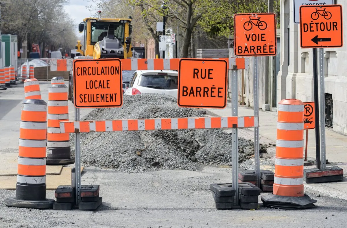 Construction cones are shown next to a construction site in Montreal, on April 25, 2023. (The Canadian Press/Graham Hughes)