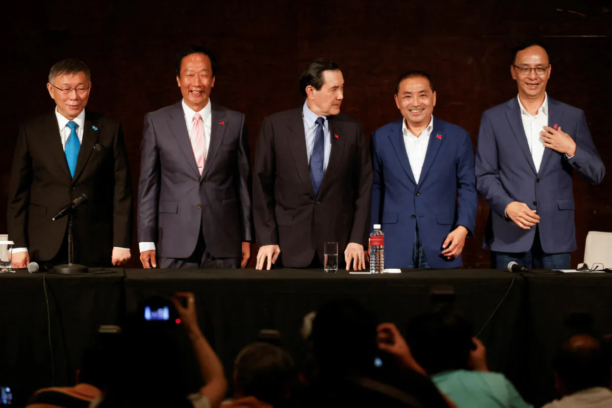 Ko Wen-je, Taiwan People's Party (TPP) chairman and presidential candidate, Terry Gou, Foxconn founder and presidential candidate, former Taiwan President Ma Ying-jeou, Hou Yu-ih, presidential candidate of the main opposition party Kuomintang (KMT), and Eric Chu, Kuomintang's chairman attend a press conference in Taipei, Taiwan, on Nov. 23, 2023. (Carlos Garcia Rawlins/Reuters)
