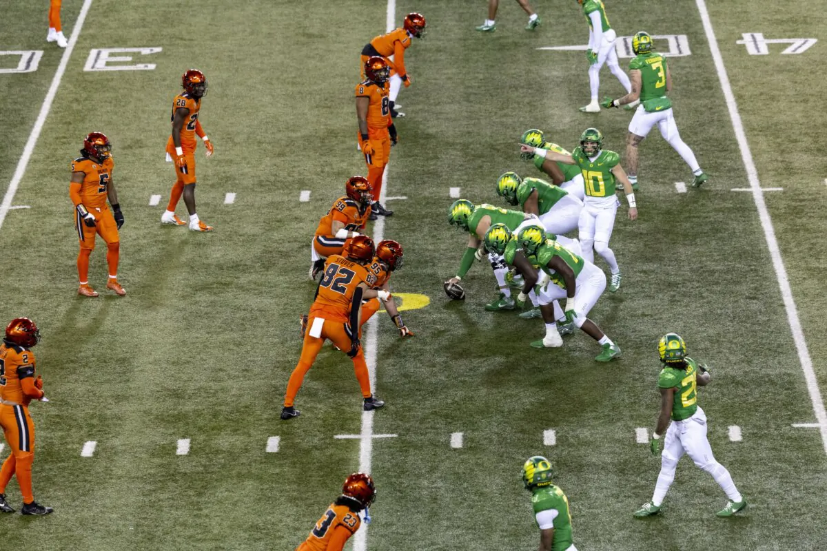 Quarterback Bo Nix (10) of the Oregon Ducks stands on line of scrimmage between the Oregon Ducks and the Oregon State Beavers during the first half at Autzen Stadium in Eugene, Ore., on Nov. 24, 2023. (Tom Hauck/Getty Images)