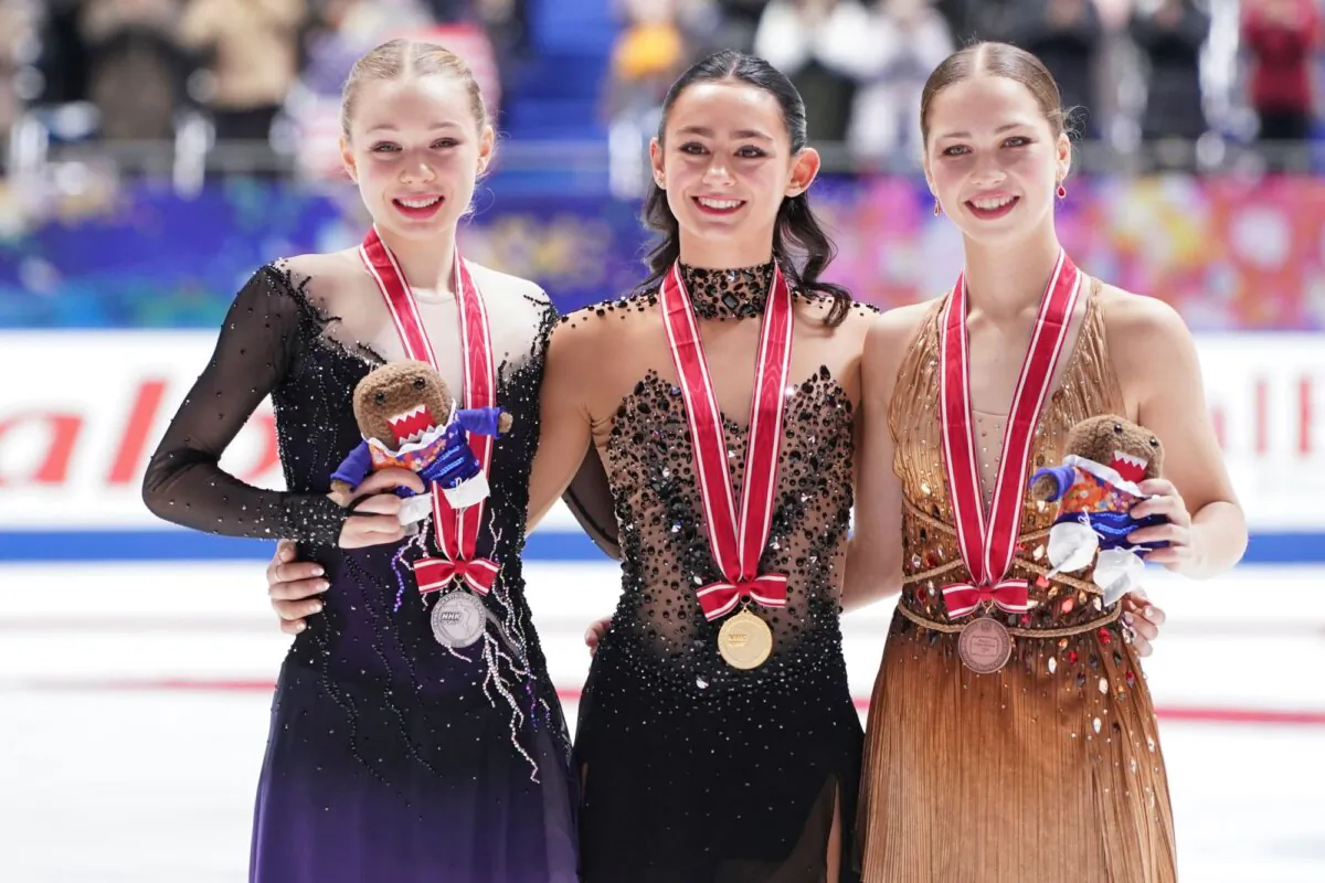 (L–R) Second placed Lindsay Thorngren of the United States, winner Ava Marie Ziegler of the United States, and third placed Nina Pinzarrone of Belgium pose after the award ceremony for the women's free skating program during the ISU Grand Prix of Figure Skating—NHK Trophy in Kadoma, near Osaka, Japan, on Nov. 25, 2023. (Tomohiro Ohsumi/AP Photo)