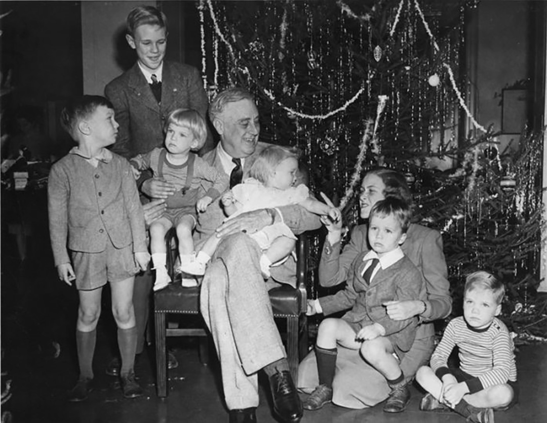 President Roosevelt surrounded by his grandchildren