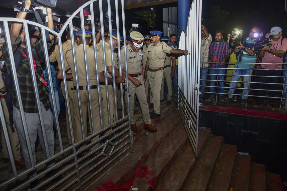 A police officer inspects the spot after a stampede at the venue of a music concert at the Cochin University of Science and Technology in Kochi, Kerala state, India, on Nov. 25, 2023. (AP Photo)