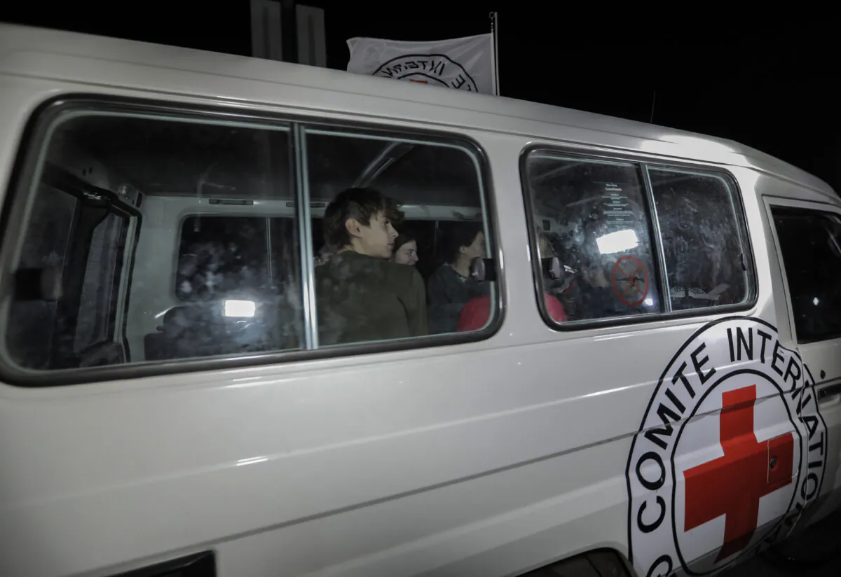 Hostages are transported in International Committee of the Red Cross vehicles from the Gaza Strip through the Rafah land crossing in Rafah, Gaza, on Nov. 25, 2023. (Ahmad Hasaballah/Getty Images)