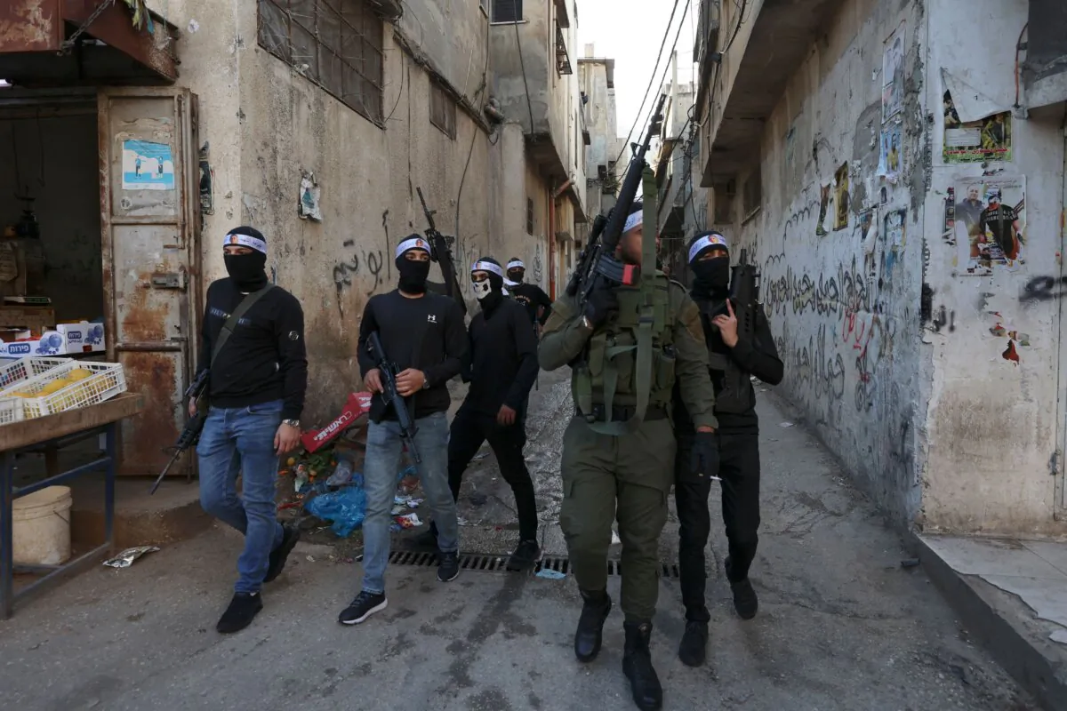 Palestinian gunmen from the Balata brigade of the Al-Aqsa Martyrs Brigades armed group, in the Balata refugee camp in the West Bank on March 17, 2023. (ZAIN JAAFAR/AFP via Getty Images)