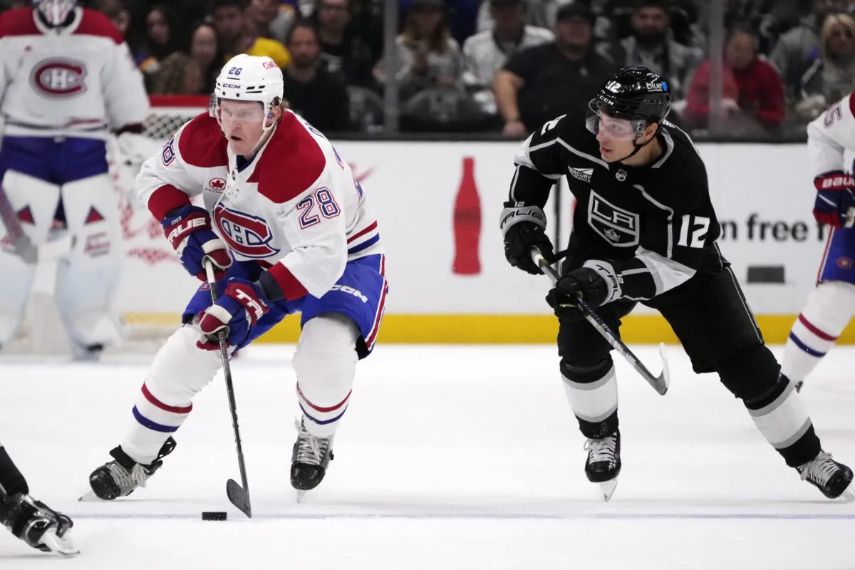 Montreal Canadiens center Christian Dvorak (28) skates past Los Angeles Kings center Trevor Moore (12) during the first period of an NHL hockey game in Los Angeles on Nov. 25, 2023. (Marcio Jose Sanchez/AP Photo)