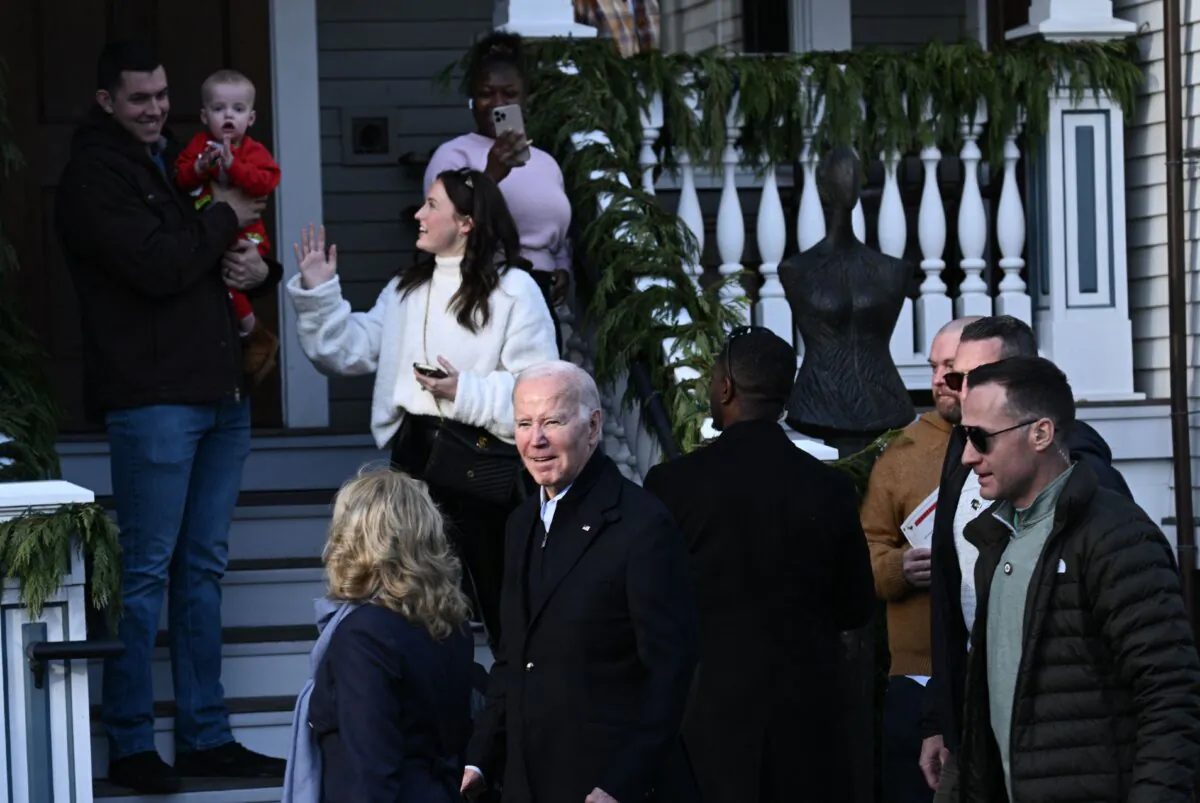 President Joe Biden, with First Lady Jill Biden greet people as they walk down the sidewalk after speaking about the release of hostages from Gaza, in Nantucket, Mass., on Nov. 24, 2023. (Brendan Smialowski/AFP via Getty Images)