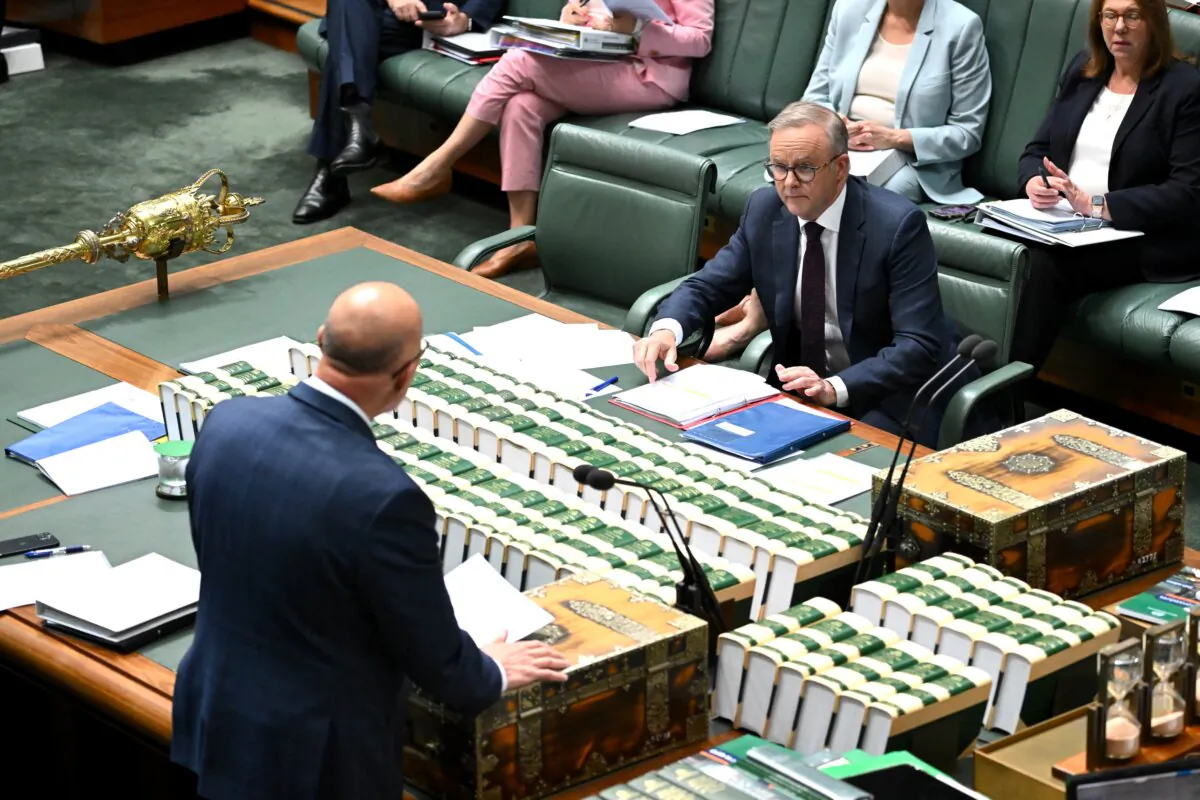 Australian Prime Minister Anthony Albanese reacts during Question Time in the House of Representatives at Parliament House in Canberra on Nov. 27, 2023. (AAP Image/Lukas Coch) 