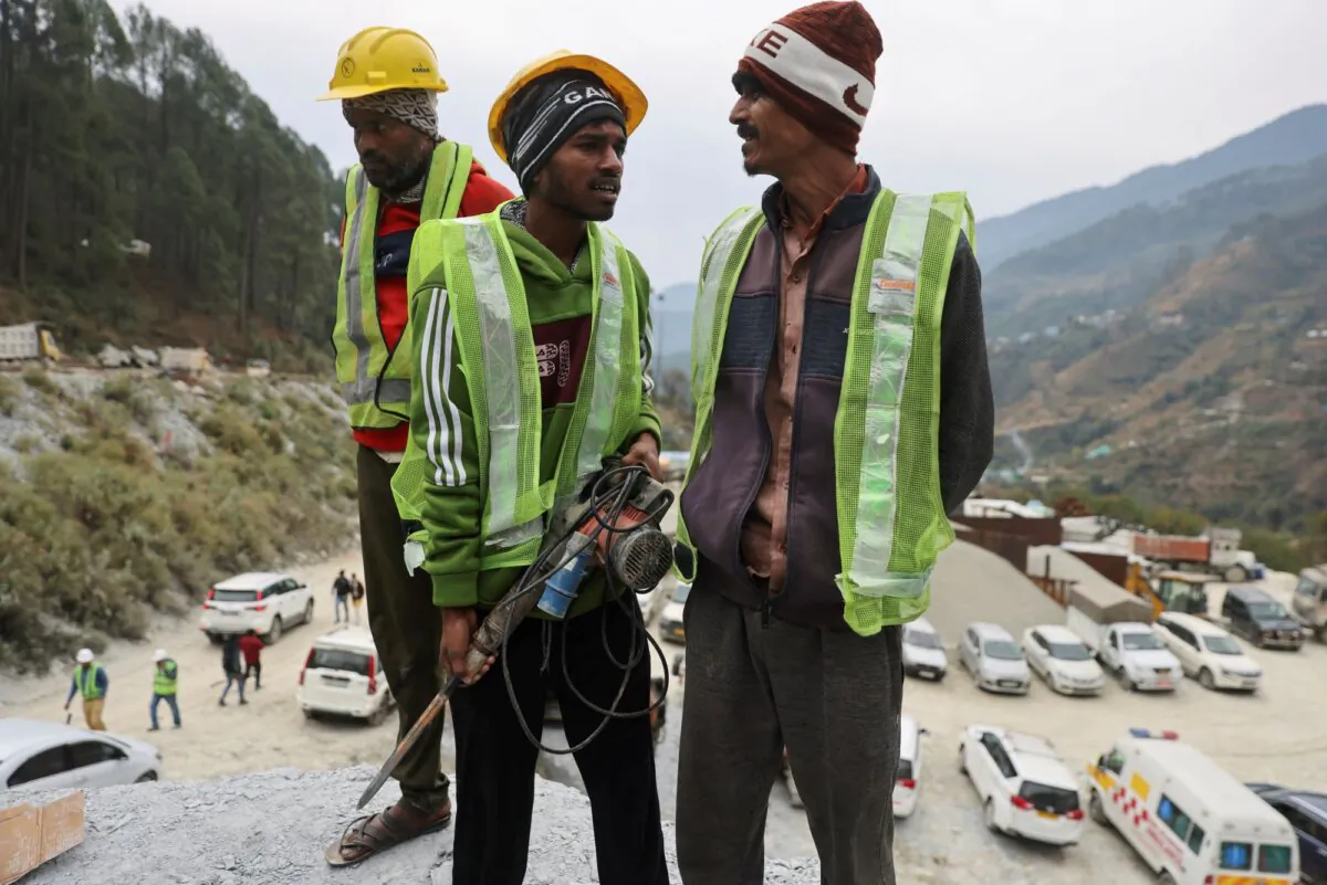 Rat miners stand before they begin manual drilling as rescue operations are in progress after workers got trapped in a collapse of an under-construction tunnel, in Uttarkashi in the northern state of Uttarakhand, India, on Nov. 27, 2023. (Francis Mascarenhas/Reuters)
