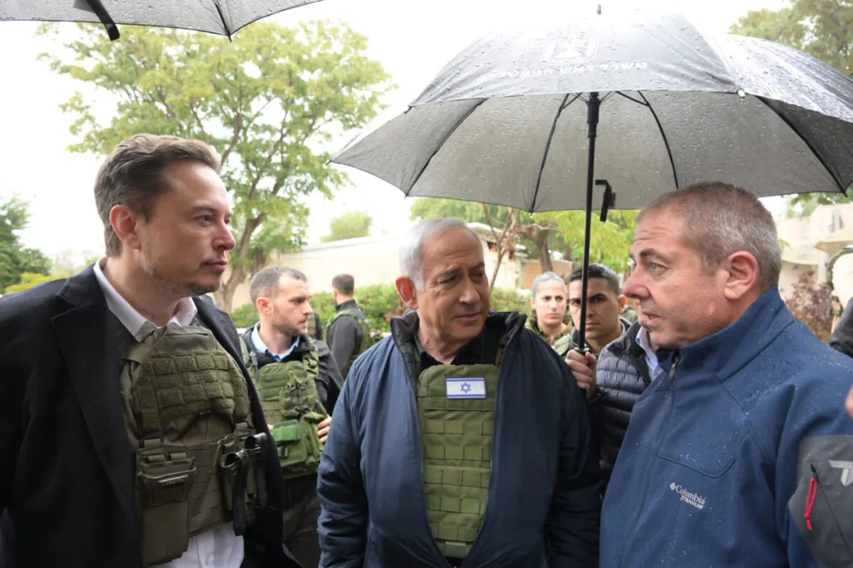 Israel's Prime Minister Benjamin Netanyahu (C) takes Elon Musk (L) on a tour of Kibbutz Kfar Aza after the Oct. 7 massacre took place there, in Kfar Aza, Israel, on Nov. 27, 2023. (Amos Ben-Gershom Handout via Getty Images)