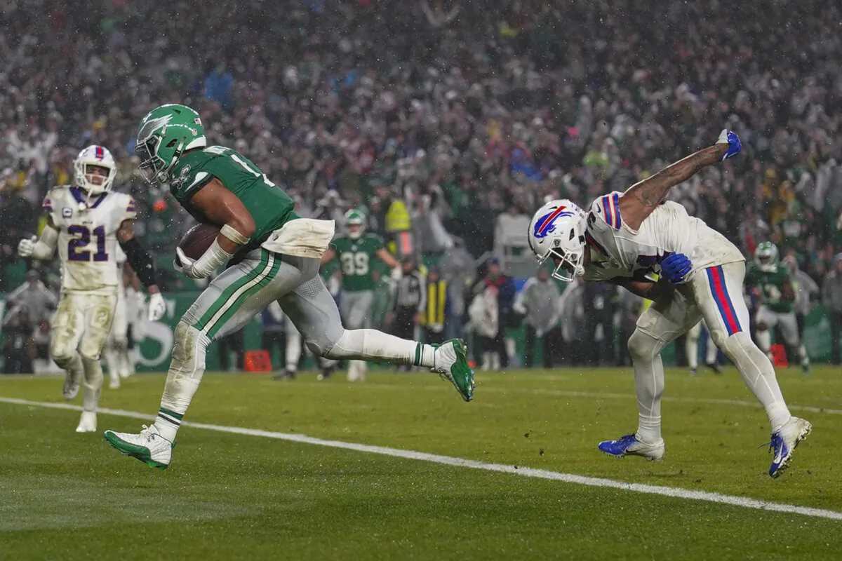 Philadelphia Eagles quarterback Jalen Hurts scores the game winning touchdown against the Buffalo Bills during overtime in an NFL football game in Philadelphia on Nov. 26, 2023. (Matt Slocum/AP Photo)