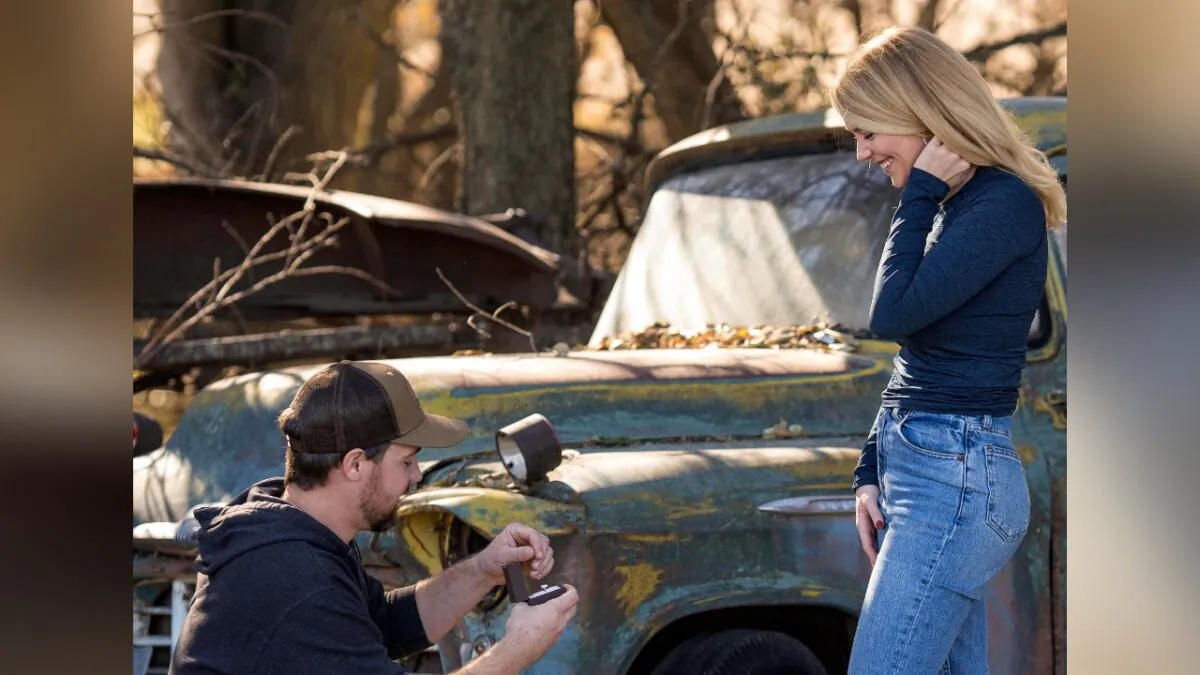 Cole Bures proposes to Samantha Camenzind during a photo shoot after she shot and killed a giant buck during a deer hunt near Filley, Neb., on Nov. 12 , 2023. (Brenton Lammers/Lammers Media via AP)