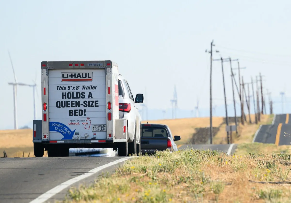 A truck towing a moving trailer drives near Rio Vista, Calif., on Sept. 15, 2023. (Josh Edelson/AFP via Getty Images)
