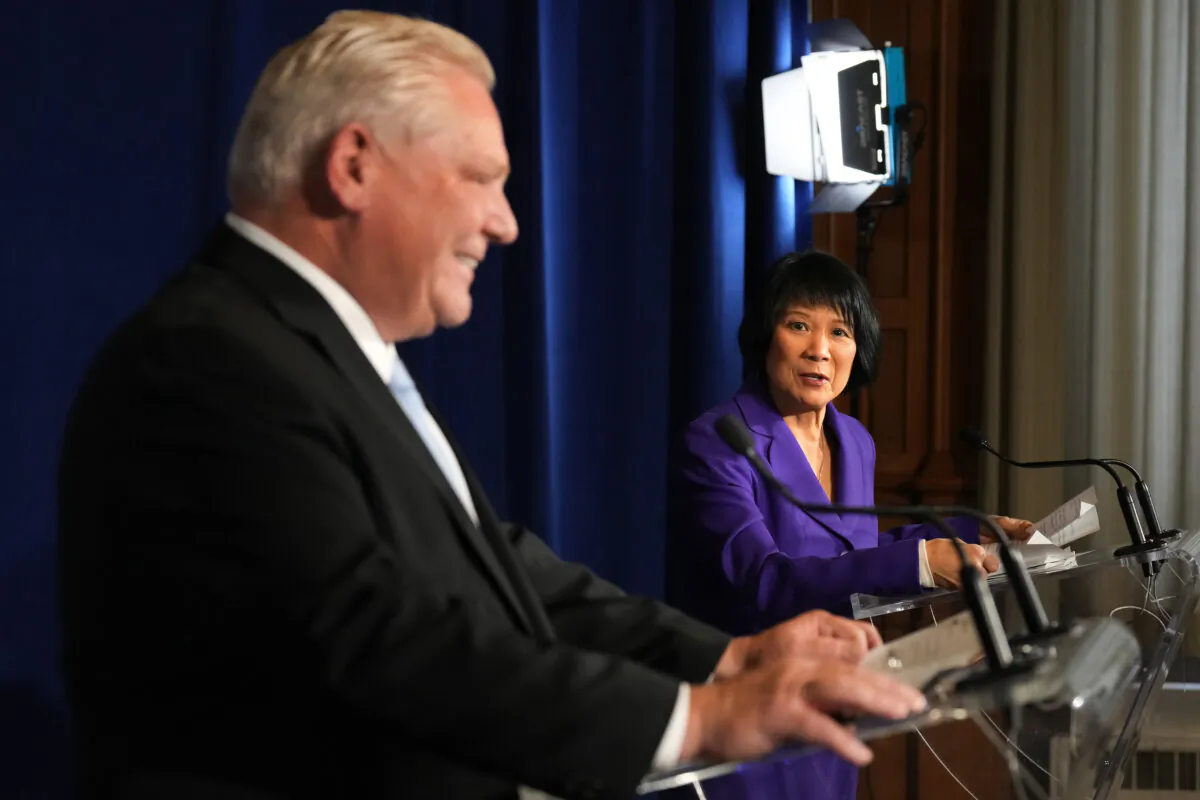 Ontario Premier Doug Ford and Toronto Mayor Olivia Chow hold a news conference in Toronto on Monday Nov. 27, 2023. Ford says the province will upload two Toronto highways in order to help alleviate the city's growing financial pressures. THE CANADIAN PRESS/Chris Young