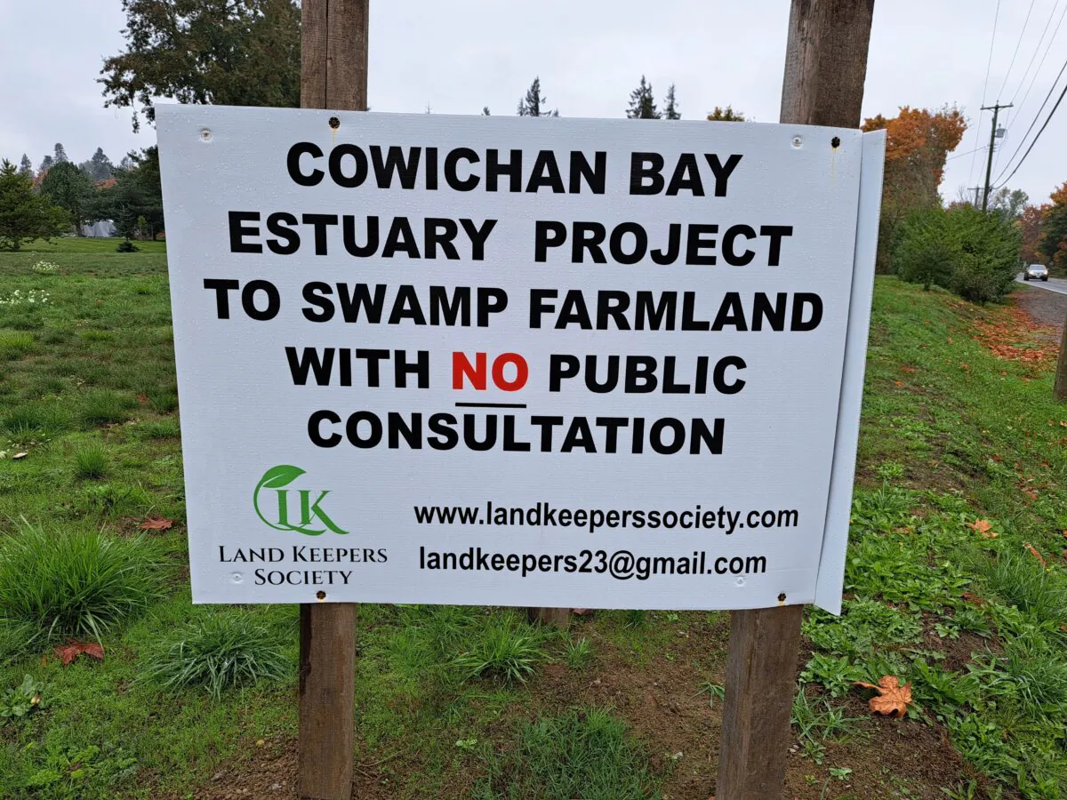 A sign erected by the Land Keepers Leadership Society, which is working to stop the flooding of productive farmland as part of an estuary restoration project in the Cowichan Valley, B.C. (Jeff Sandes/The Epoch Times)