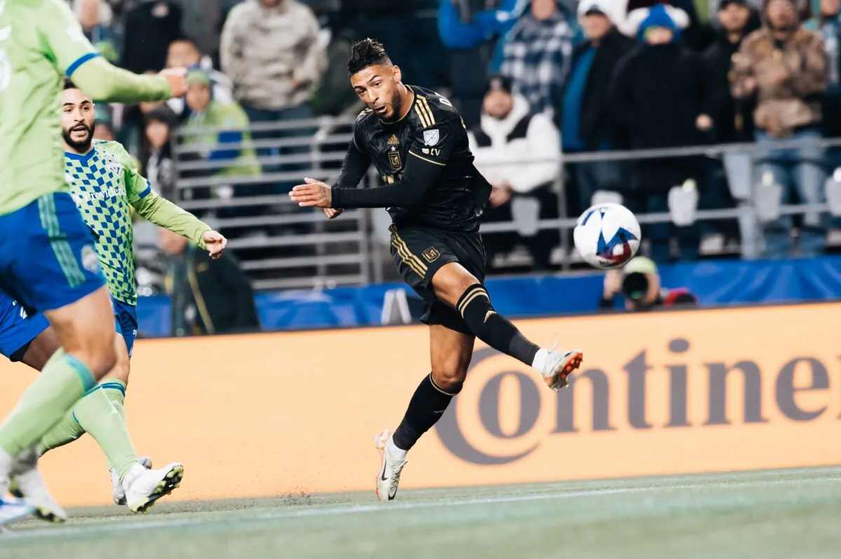 Los Angeles FC forward Denis Bouanga (99) takes a shot to score as Seattle Sounders defenders converge during the first half of an MLS conference semifinal playoff soccer match in Seattle on Nov. 26, 2023. (Courtesy of LAFC via The Epoch Times)