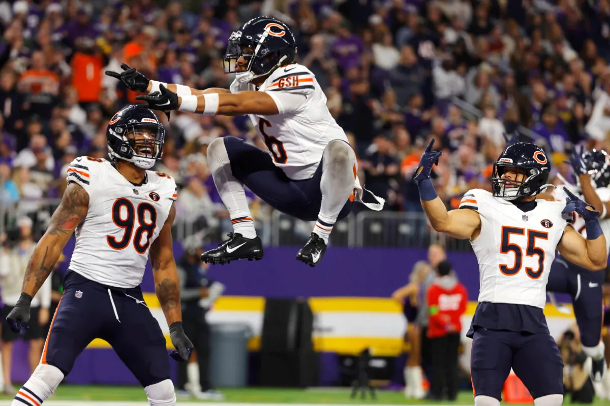 Chicago Bears cornerback Kyler Gordon (6) celebrates with teammates defensive end Montez Sweat (98) and linebacker Dylan Cole (55) after intercepting a pass during the second half of an NFL football game against the Minnesota Vikings in Minneapolis on Nov. 27, 2023. (Bruce Kluckhohn/AP Photo)