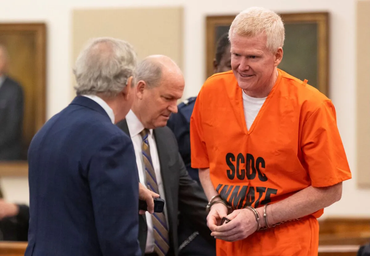 Alex Murdaugh talks with his attorneys Dick Harpootlian, (L), and Jim Griffin during his sentencing for stealing from 18 clients, at the Beaufort County Courthouse in Beaufort, S.C., on Nov. 28, 2023. (Andrew J. Whitaker/Pool/The Post And Courier via AP)