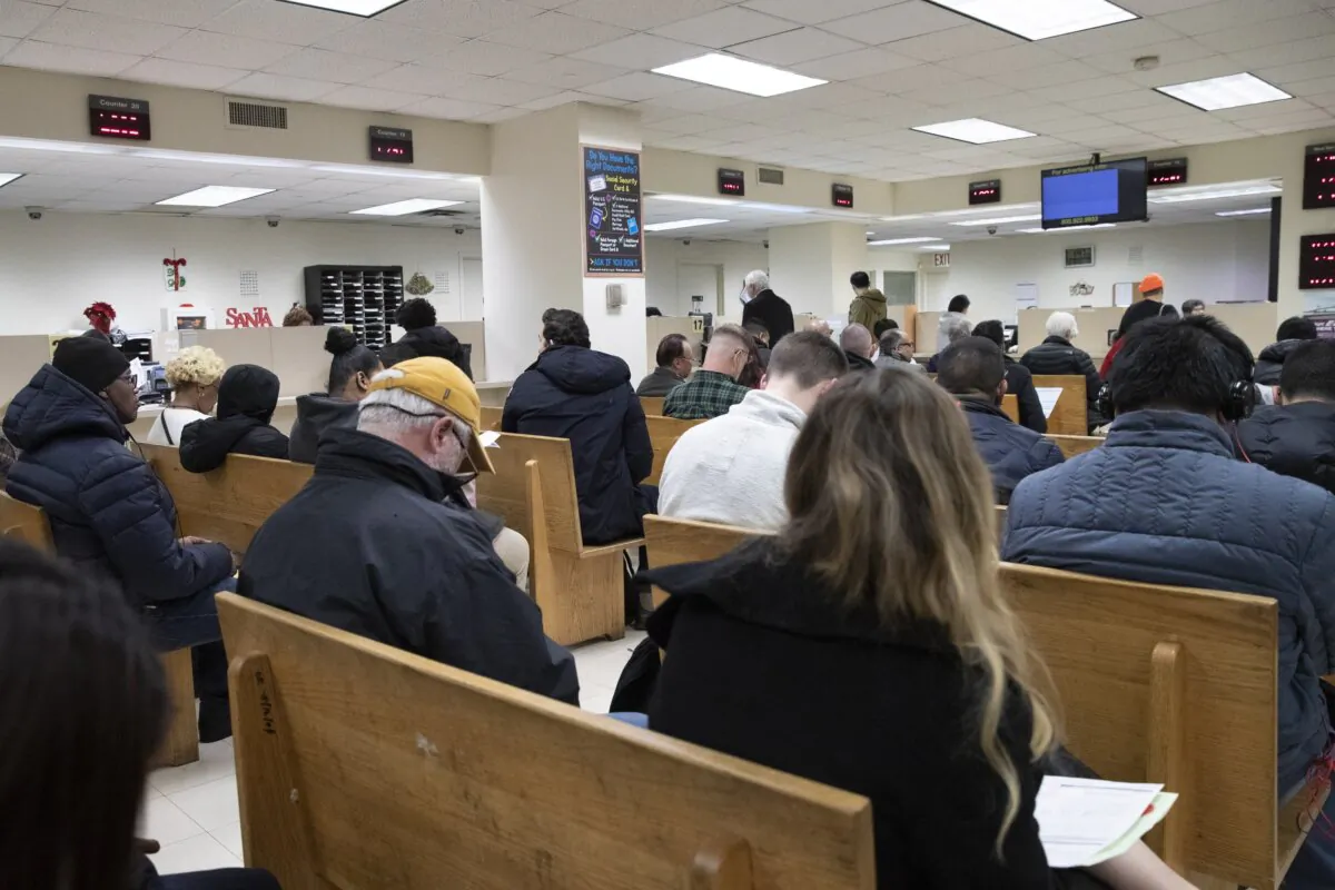 People wait to be served in a Department of Motor Vehicles office in New York on Dec. 16, 2019. (Mark Lennihan/AP Photo)