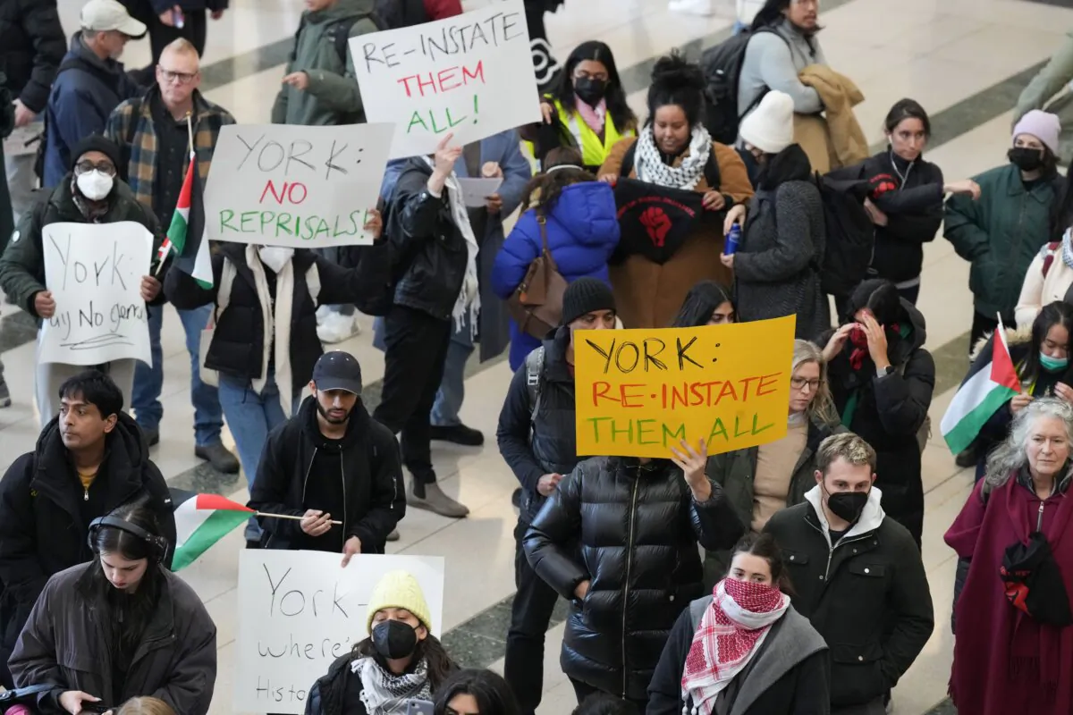 A group of students and staff at Toronto's York University protest on Nov. 28, 2023, to ask for the reinstatement of employees suspended after being arrested on charges of vandalizing an Indigo store. (The Canadian Press/Chris Young)