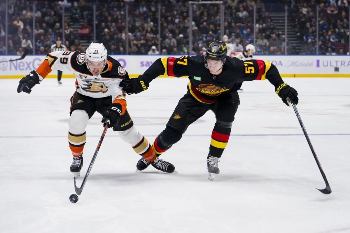 Vancouver Canucks defenseman Tyler Myers (57) battles with Anaheim Ducks forward Sam Carrick (39) in the first period in  Vancouver, British Columbia, on Nov. 28, 2023 (Bob Frid/USA TODAY Sports via Field Level Media)