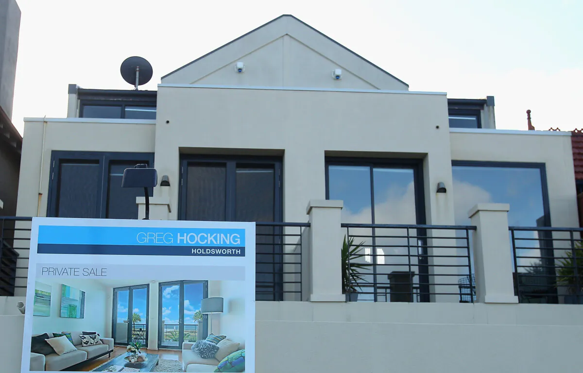 A sale board stands out the front of a property in Melbourne, Australia, on June 17, 2011. (Quinn Rooney/Getty Images)