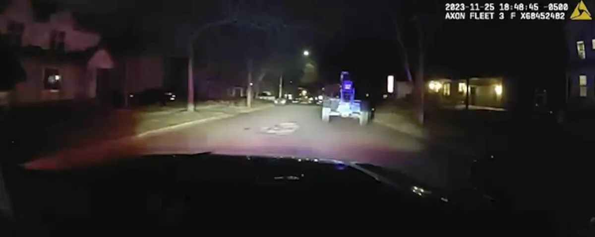 A patrol car chases a stolen forklift driving through the streets of Ann Arbor, Mich., on Nov. 25, 2023. (Ann Arbor Police Department via AP)