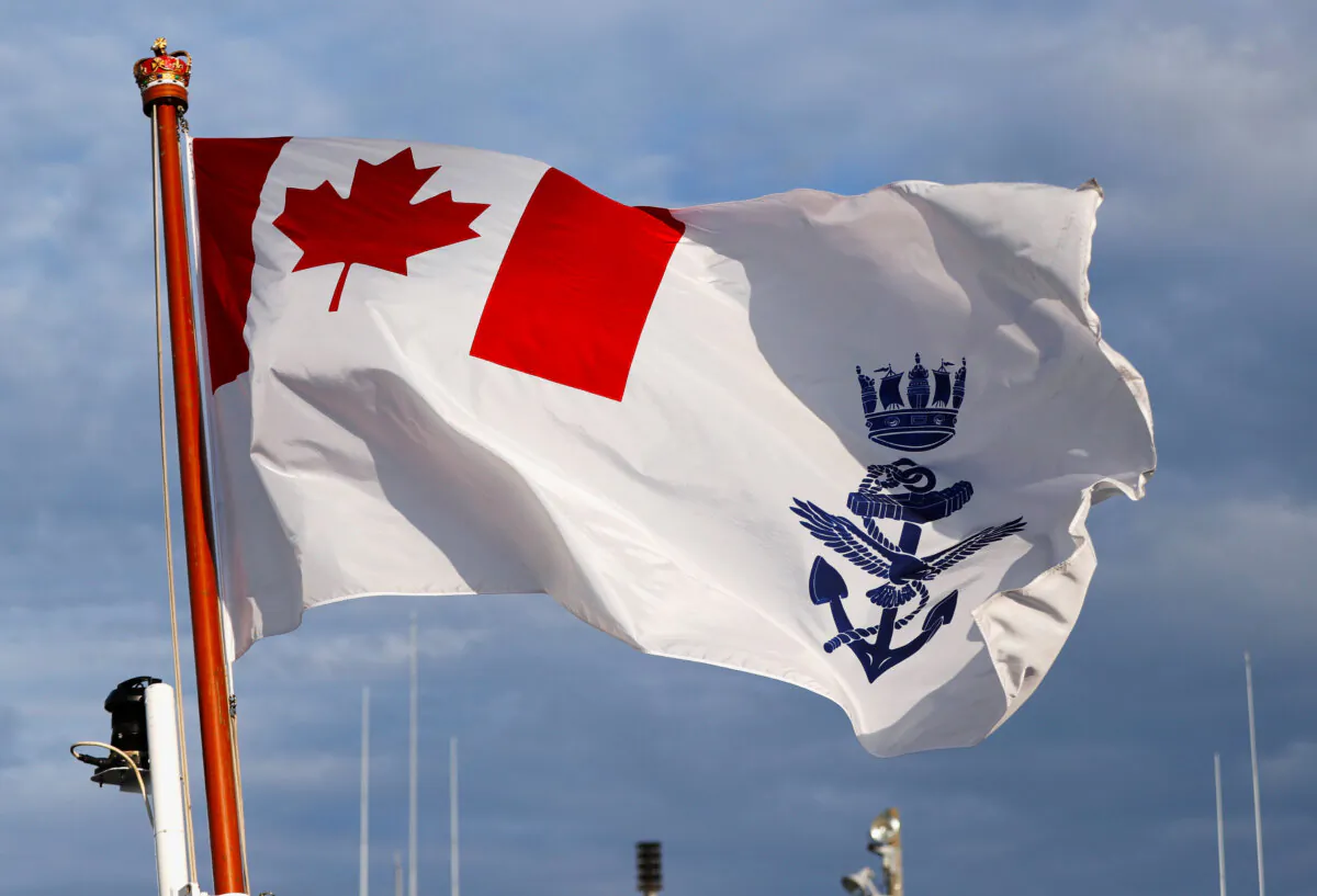 Canadian naval ensign is hoisted on the deck of the Royal Canadian Navy's Halifax-class frigate HMCS Calgary (FFH335) at the U.S. naval base in Yokosuka, Japan, on Nov. 7, 2018. (Reuters/Issei Kato)