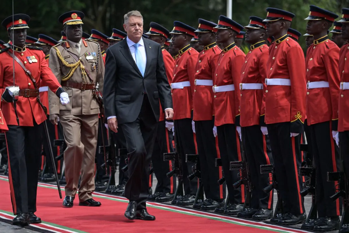Romanian President Klaus Iohannis (C) inspects the Guard of Honor as he arrives for the ceremonial welcome at the State House in Nairobi, Kenya, on Nov. 14, 2023. (Simon Maina/AFP via Getty Images)