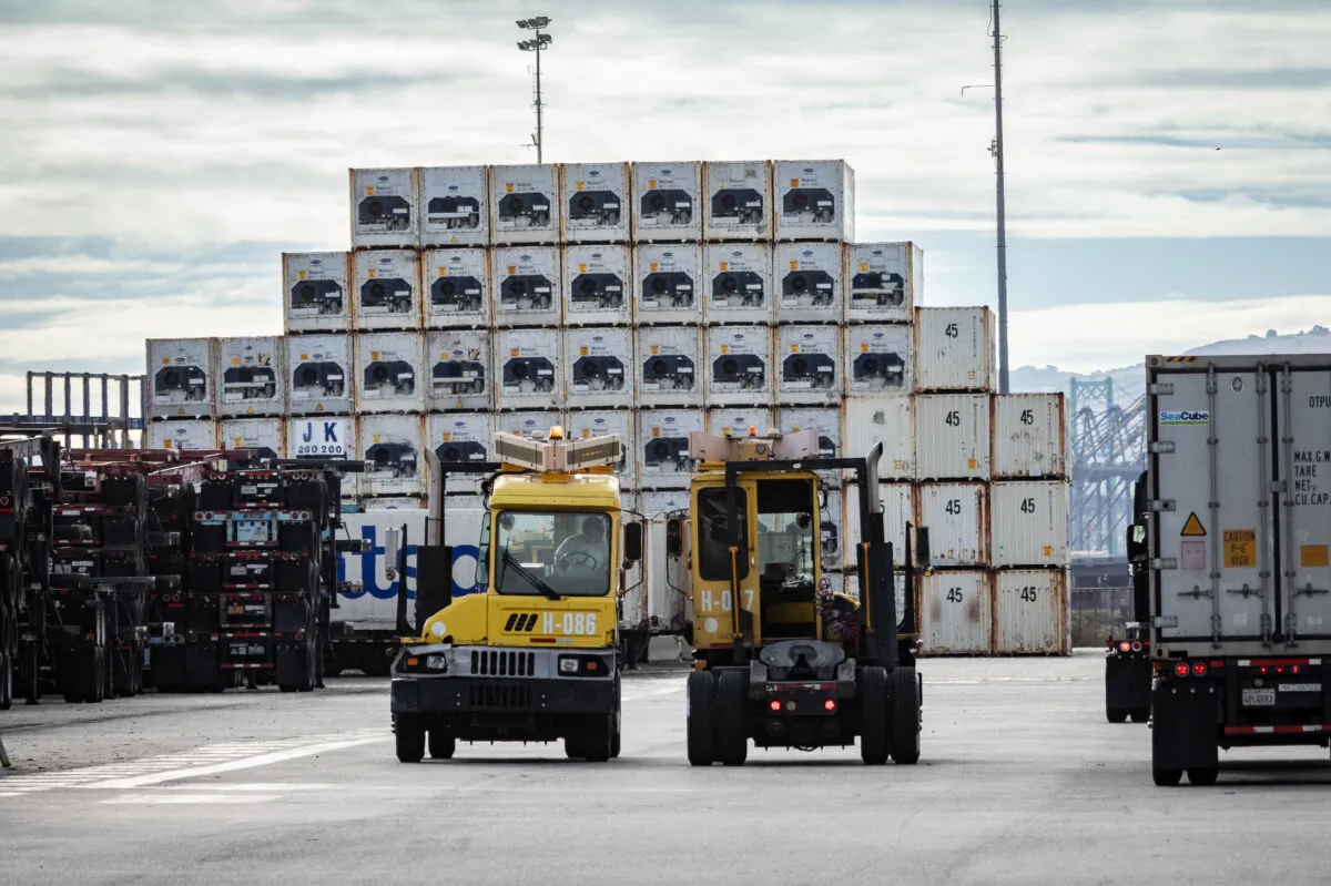 Truckers transport cargo in the Port of Long Beach, Calif., on Nov. 29, 2023. (John Fredricks/The Epoch Times)