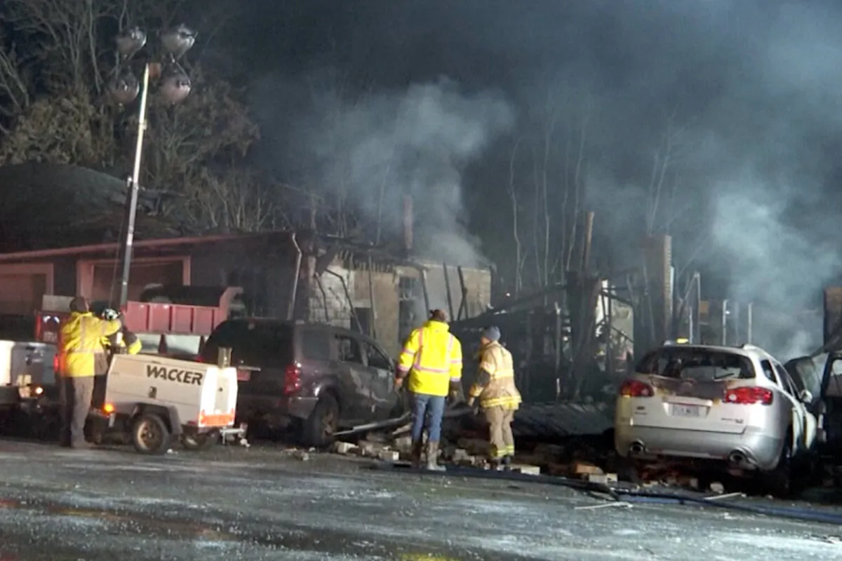 Emergency personnel work at the scene of a deadly fire at Jimbo’s Auto Repair in Hillsboro, Ohio, on Nov. 28, 2023. (WCPO via AP)