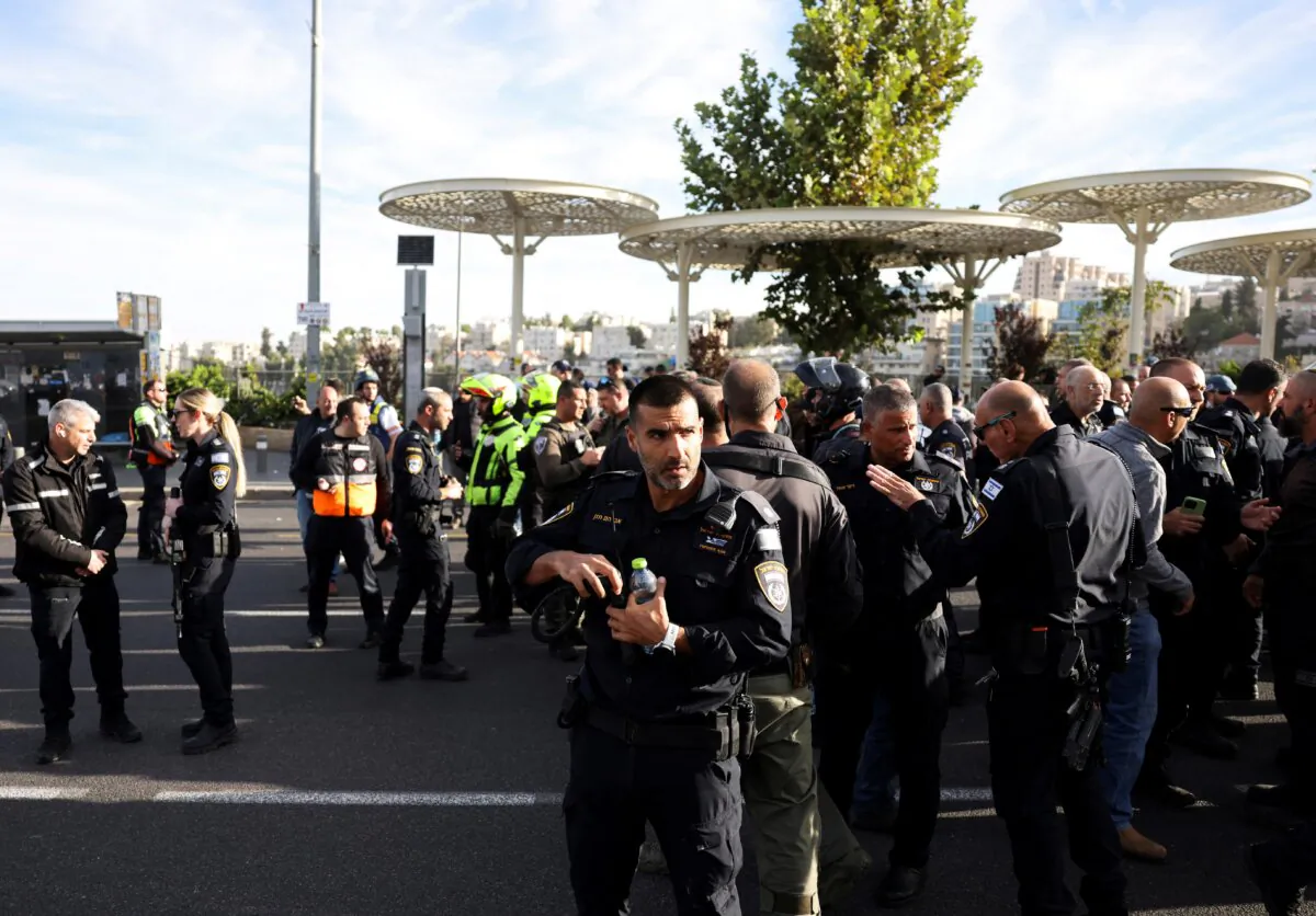 Israeli officials work at the scene of a violent incident in Jerusalem on Nov. 30, 2023. (Ronen Zvulun/Reuters)