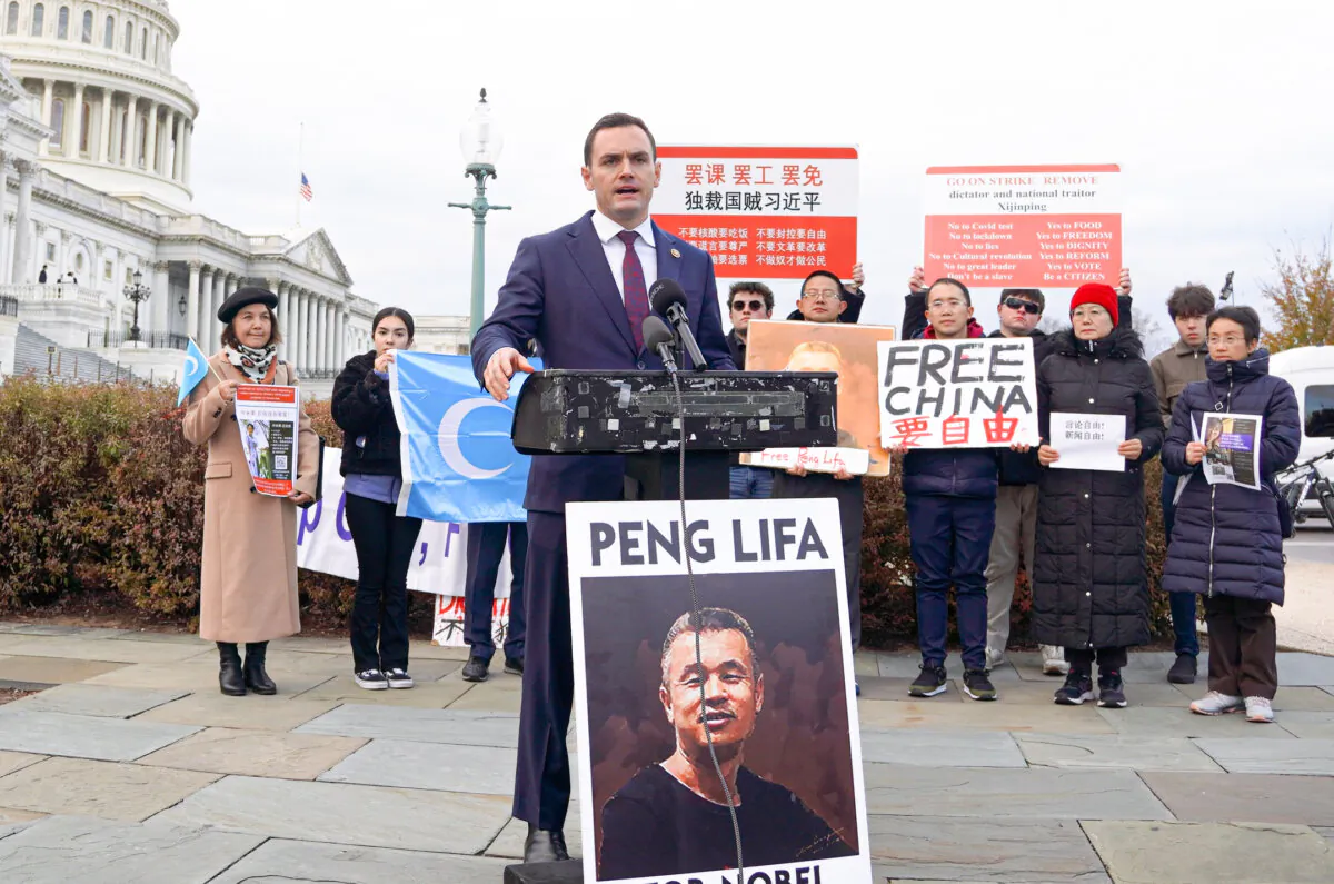 Rep. Mike Gallagher (R-Wis.) (left), chair of the House Select Committee on the Chinese Communist Party (CCP), speaks at the first anniversary of the White Paper Movement, in which Chinese citizens held a blank sheet of paper to protest the CCP's atrocity, outside the U.S. Capitol on Nov. 29, 2023. (Terri Wu/The Epoch Times)