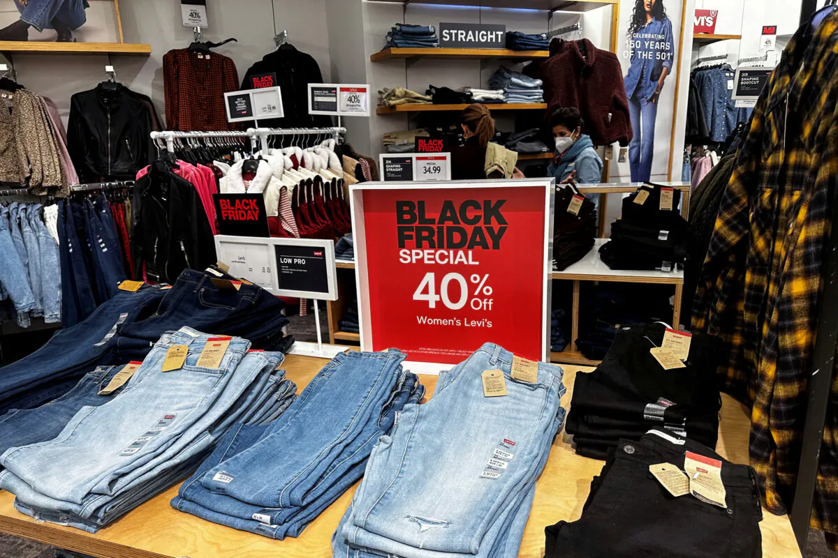 Shoppers look at clothes during Black Friday deals at Macy’s department store at the Roosevelt Field mall in Garden City, New York, on Nov. 24, 2023. (Shannon Stapleton/Reuters)