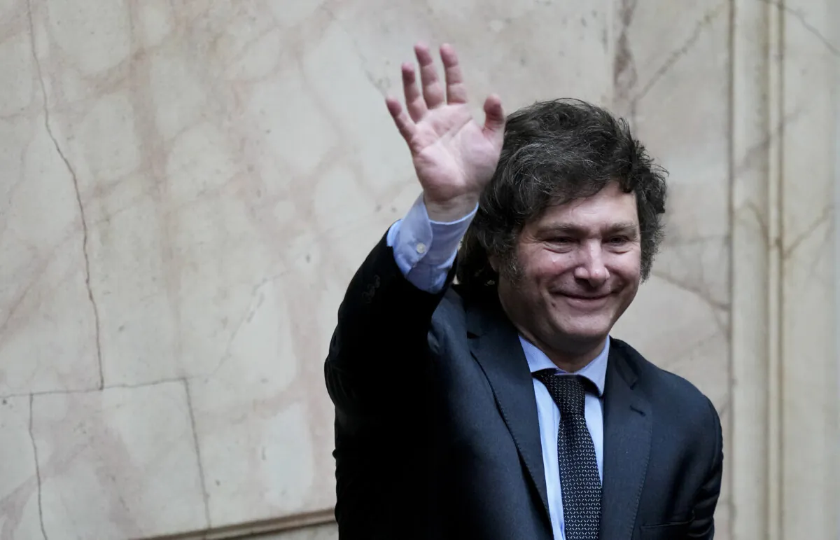 President-elect Javier Milei waves during a joint session of Congress to officially declare him and his running mate winners of the presidential runoff election in Buenos Aires, Argentina, on Nov. 29, 2023. (Natacha Pisarenko/AP Photo)